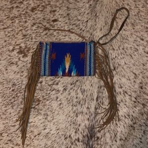 Aztec fringe wristlet with leather handle